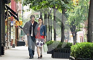 Couple Walking On sidewalk