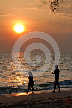 A couple walking in the sunset