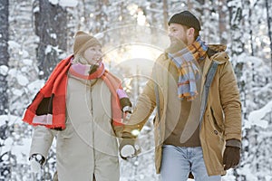 Couple walking together in the forest