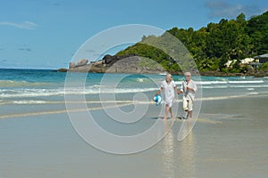 Couple walking on tropical beach