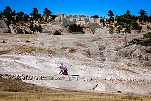 A couple walks through the Valley of the Monks in Creel, Mexico