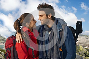 Couple in warm clothes trekking