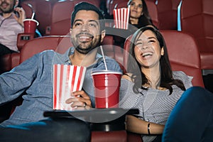 Couple watching comedy at the theater