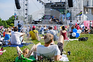 Couple is watching concert at open air music festival