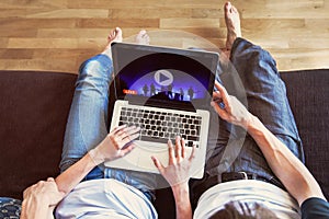 couple watching live streaming online concert