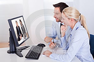 Couple watching an online presentation