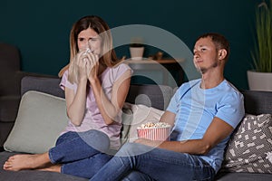 Couple watching soap opera in evening