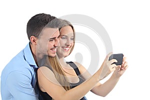 Couple watching social media on the smart phone