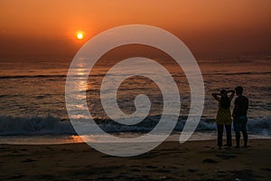 A Couple Watching the Sunrise