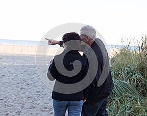 Couple watching sunset.