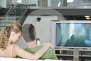 Couple Watching TV At Home