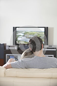 Couple Watching TV Together At Home