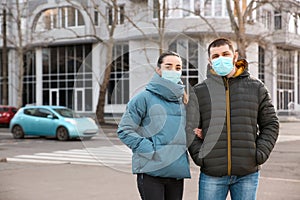 Couple wearing disposable masks. Dangerous virus