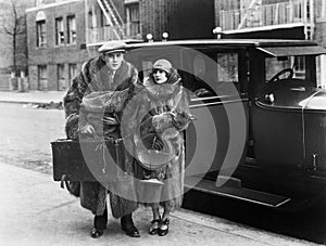 Couple wearing fur coats