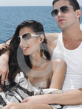 Couple Wearing Sunglasses On Yacht