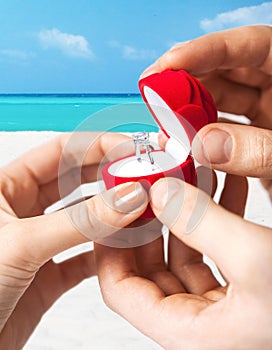 Couple with wedding ring and gift box