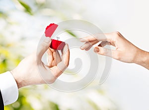 Couple with wedding ring and gift box