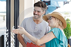 couple window shopping together