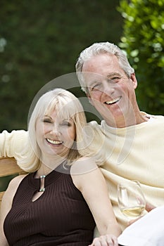Couple With Wineglass In Garden