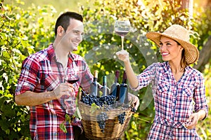 Couple winegrower tasting wine