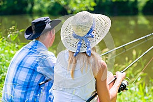 Couple, woman and man, with fishing rods sport angling