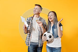 Couple, woman man, football fans holding bitcoin, metal golden coin, up arrow, soccer ball, cheer up support team