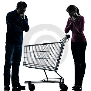 Couple woman man sad with empty shopping cart silhouette