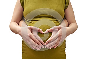 A couple of women making a heart shape on the pregnant belly wit