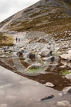 Couple of women walking on a path to the top of Croagh Patrick mountain. County Mayo, Ireland. Popular landmark for pilgrimage and