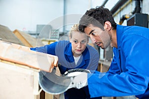 Couple workers and model roof gutter