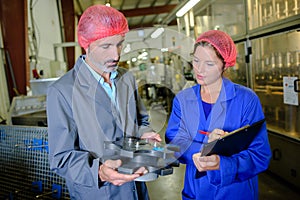 Couple working in factory