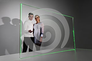 Couple working with futuristic display