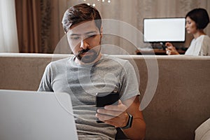 Couple Working And Playing With Laptop Computer At Home