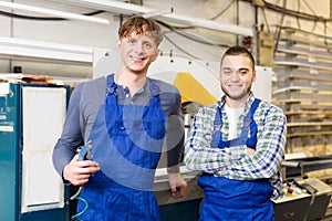 Couple of workmen at factory