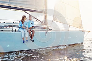 Couple, yacht cruise and ocean in summer with sunshine, love and romance on outdoor adventure. Happy couple, boat and