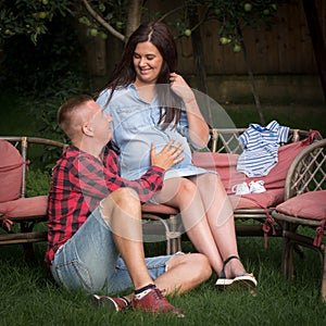 Couple of young adults are waiting to be born their first child