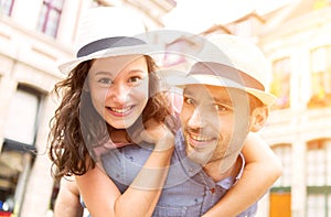 Couple of young attractive tourists discovering city on holidays