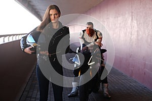 Couple of young bikers is relaxing in quiet tunnel with their motobike