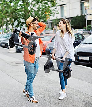 couple young electric scooter city transport riding technology lifestylestreet friend driving modern