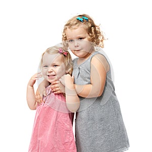 Couple of young little girls standing over isolated white background