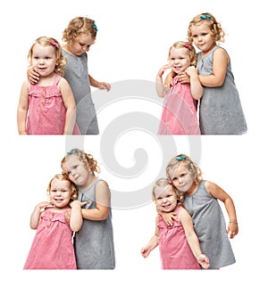 Couple of young little girls standing over isolated white background