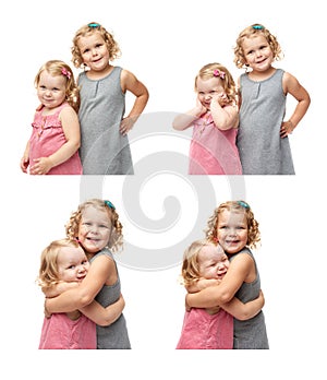 Couple of young little girls standing over isolated white background