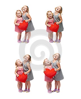 Couple of young little girls standing over isolated white background