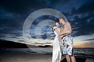 Couple of young lovers on the beach