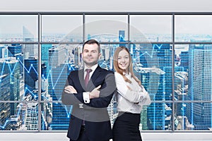 Couple of young managers are standing in the modern panoramic office. New York view. Financial charts are drawn over the panoramic