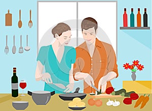 Couples are cooking together in the kitchen. There are bottles of wine and cookware on the blue wall.