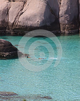 Couples of diver snorkeling in clear sea water