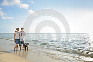 Couples with dog at beach