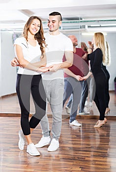 Couples enjoying of partner dance