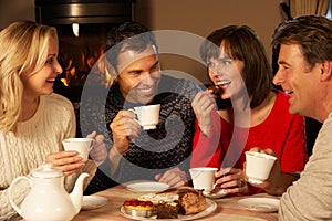 Couples Enjoying Tea And Cake Together